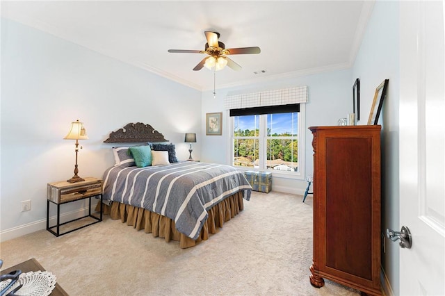 bedroom featuring ceiling fan, ornamental molding, and light carpet