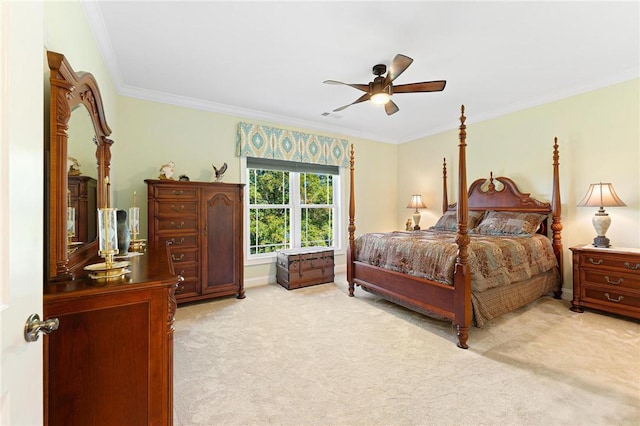 carpeted bedroom featuring ceiling fan and ornamental molding