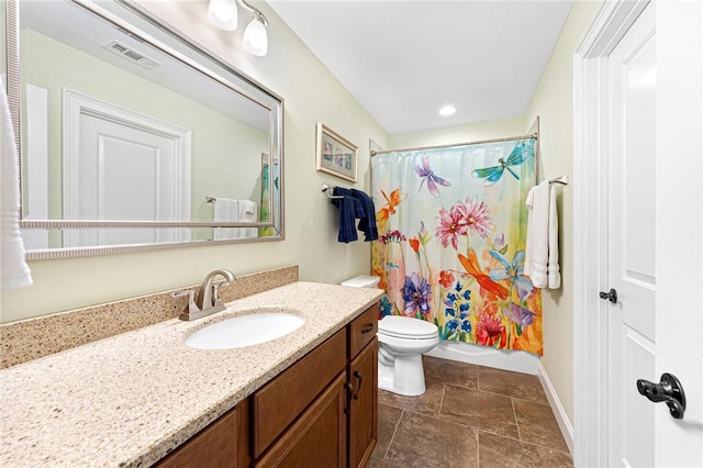 full bathroom featuring shower / bath combo, vanity, and toilet