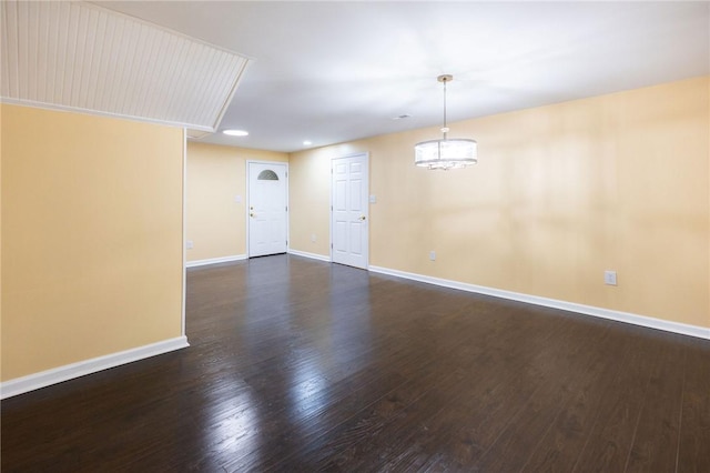 spare room with dark hardwood / wood-style floors