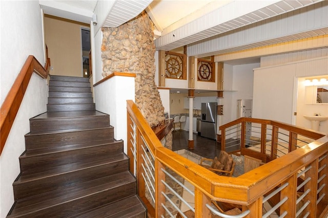 staircase featuring wood-type flooring