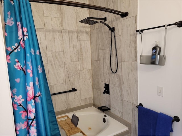 bathroom featuring tiled shower / bath