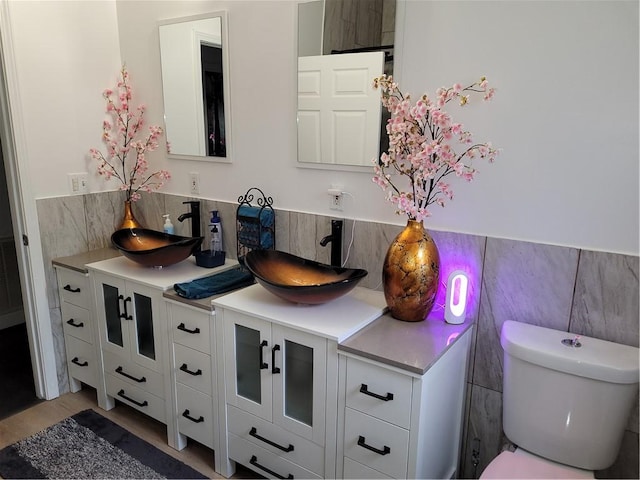 bathroom featuring toilet and vanity