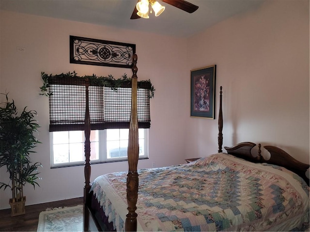 bedroom featuring wood finished floors and a ceiling fan