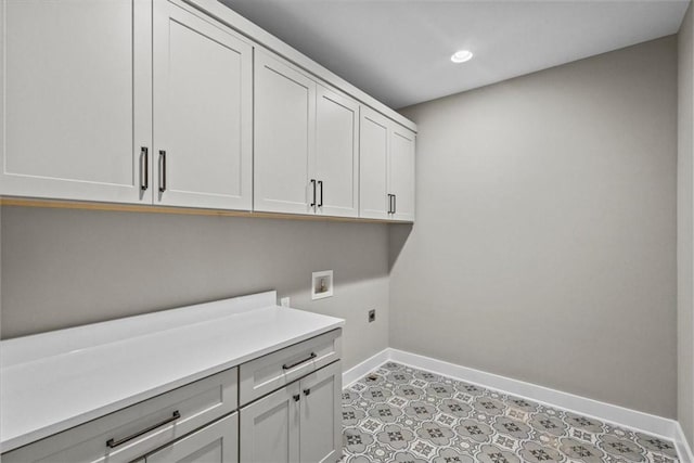 laundry area featuring cabinets, hookup for a washing machine, and electric dryer hookup