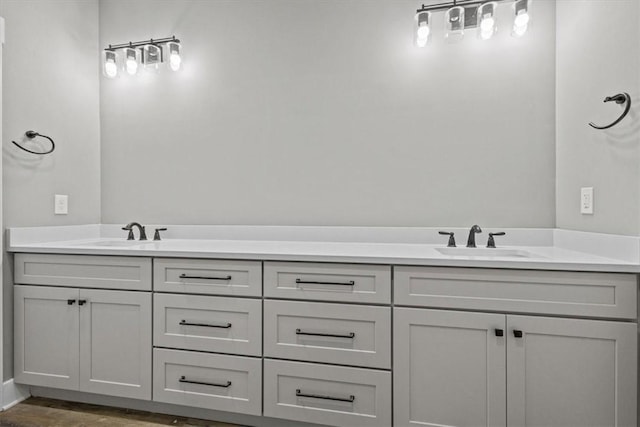 bathroom with vanity and hardwood / wood-style flooring