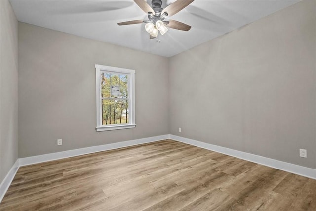 unfurnished room featuring hardwood / wood-style flooring and ceiling fan