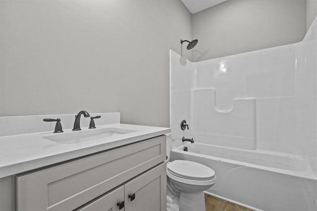 full bathroom featuring hardwood / wood-style flooring, vanity, toilet, and shower / bath combination