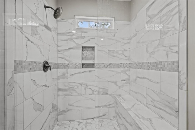 bathroom with a tile shower