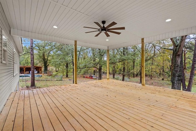 wooden deck featuring ceiling fan