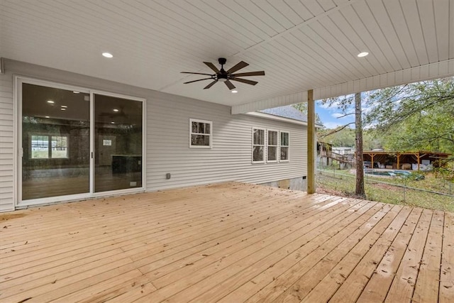 wooden deck featuring ceiling fan