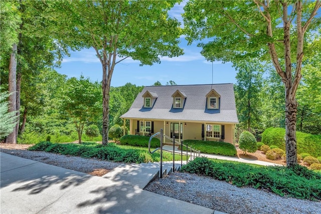 cape cod-style house with a porch