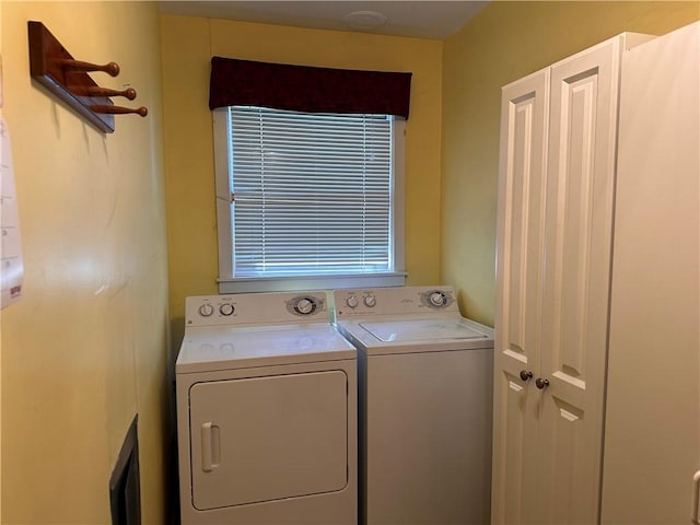 laundry room with separate washer and dryer