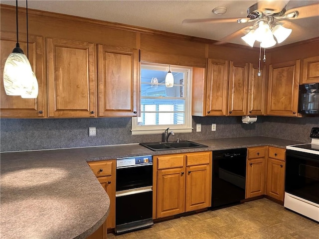 kitchen featuring black appliances, ceiling fan, pendant lighting, and sink