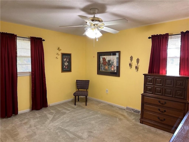 unfurnished room with light carpet and ceiling fan