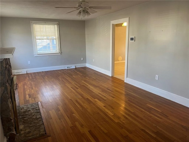 unfurnished room with ceiling fan and wood-type flooring