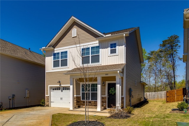 craftsman-style home with a garage and a front yard