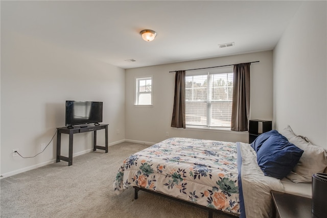 bedroom with light colored carpet