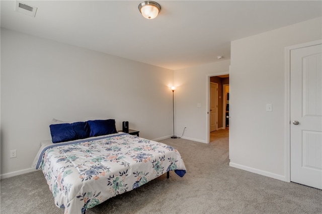 bedroom with light colored carpet