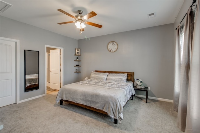 bedroom with ceiling fan and light colored carpet