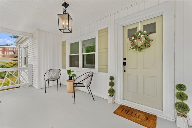 property entrance featuring covered porch