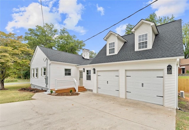 new england style home with a garage