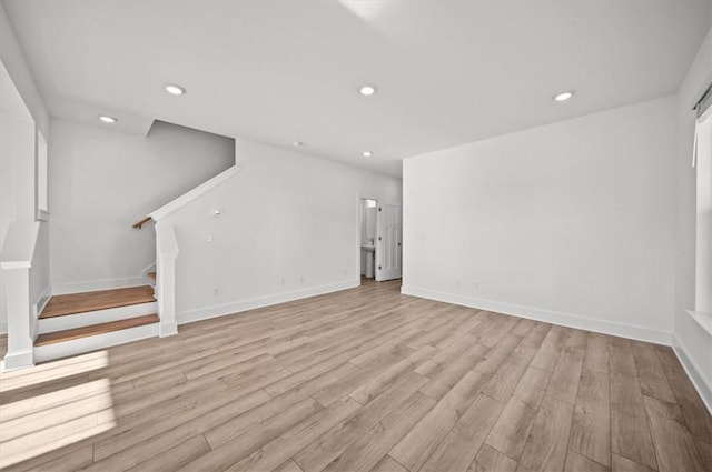 unfurnished living room featuring light wood-type flooring