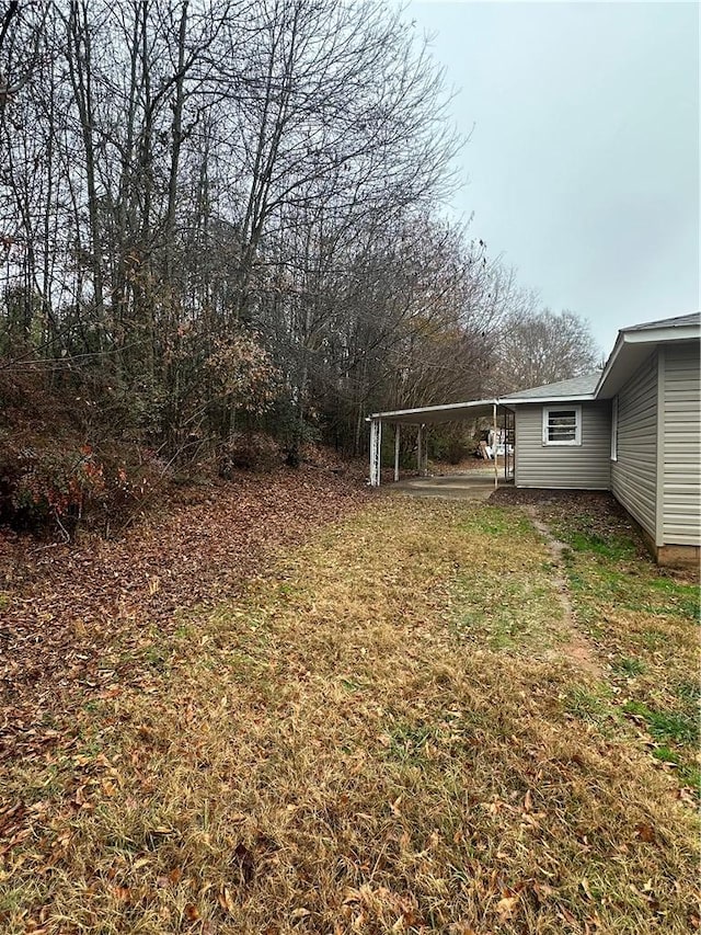 view of yard featuring a carport