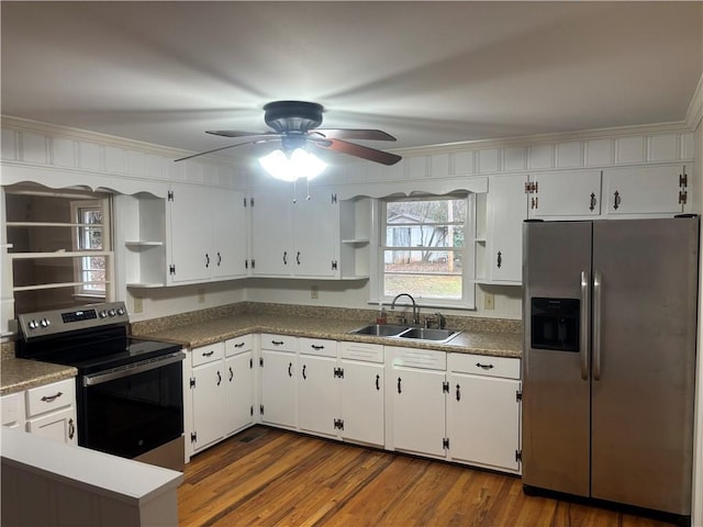 kitchen featuring sink, ornamental molding, dark wood-type flooring, appliances with stainless steel finishes, and white cabinets