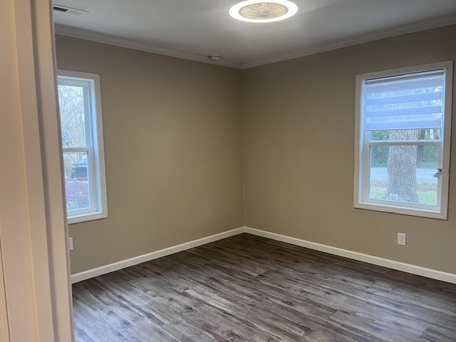 unfurnished room featuring dark hardwood / wood-style floors and ornamental molding