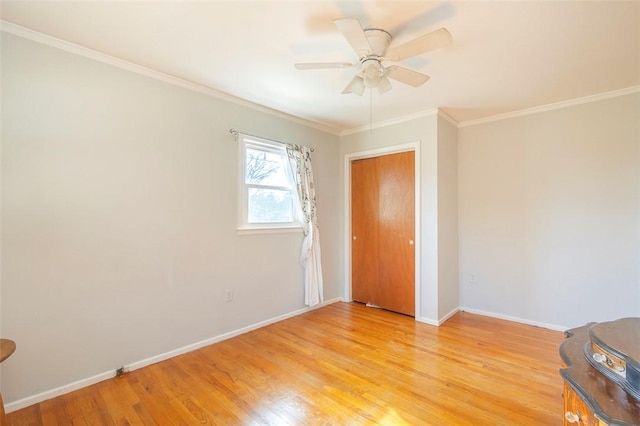 spare room featuring ceiling fan, light hardwood / wood-style floors, and ornamental molding