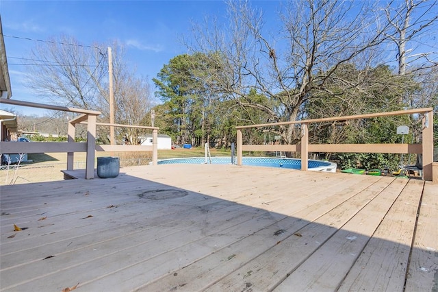 wooden deck with an empty pool