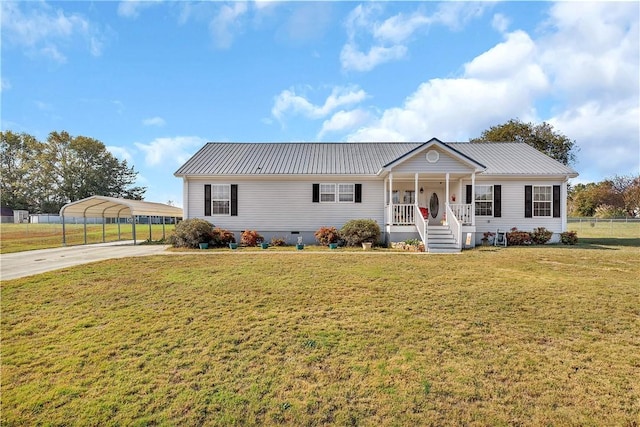 ranch-style home with a front yard, a carport, and covered porch