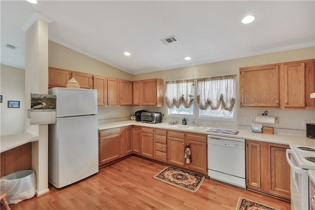 kitchen with lofted ceiling, white appliances, crown molding, sink, and light hardwood / wood-style floors