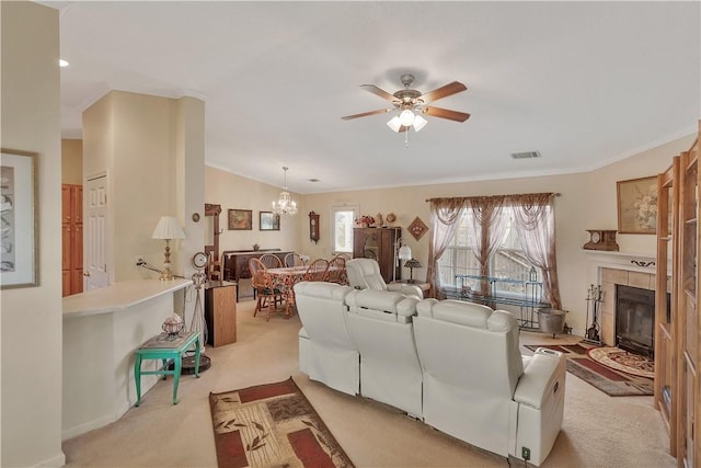 living room with light carpet, ceiling fan with notable chandelier, crown molding, a fireplace, and lofted ceiling