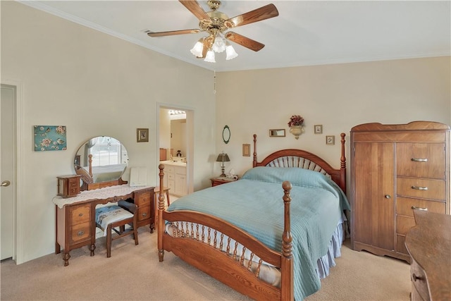 bedroom featuring ensuite bathroom, crown molding, ceiling fan, and light colored carpet