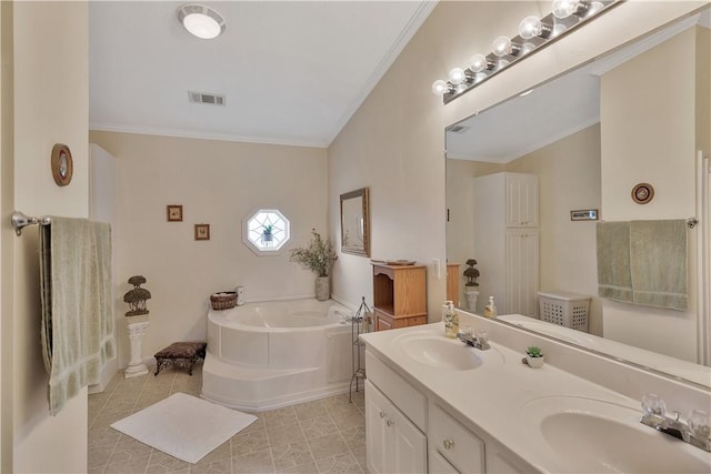 bathroom with a tub, crown molding, tile patterned flooring, and vanity