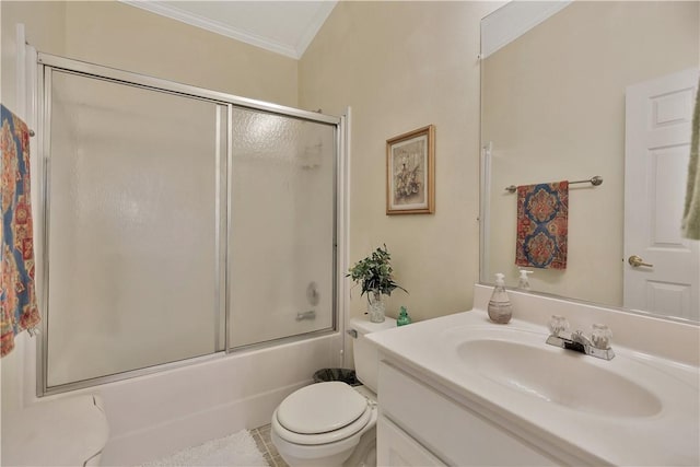 full bathroom featuring vanity, tile patterned flooring, toilet, ornamental molding, and enclosed tub / shower combo