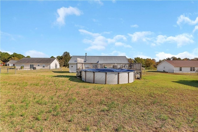 view of yard with a covered pool