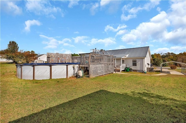 view of yard featuring a swimming pool side deck