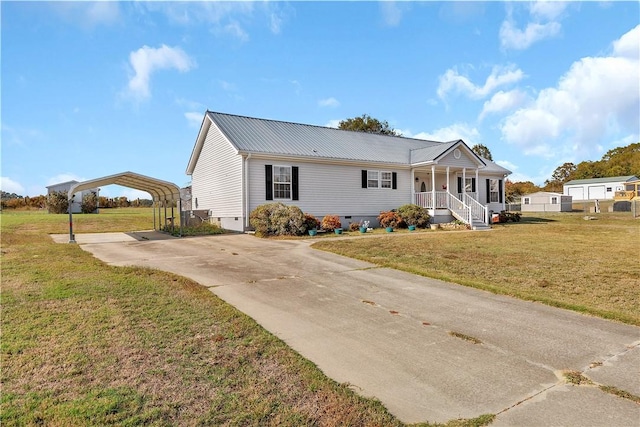 view of front of property featuring covered porch, a front lawn, and a carport