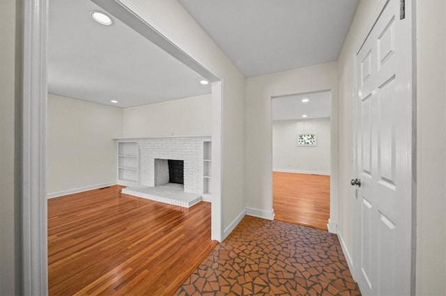 unfurnished living room featuring a fireplace