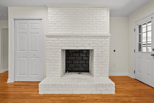 details with a fireplace and hardwood / wood-style flooring