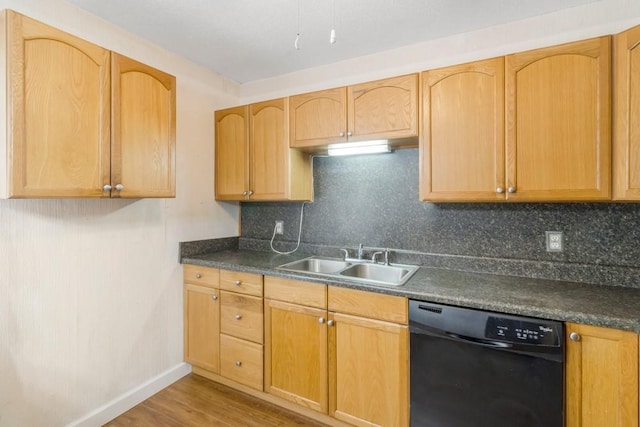 kitchen with hardwood / wood-style floors, backsplash, sink, black dishwasher, and light brown cabinetry