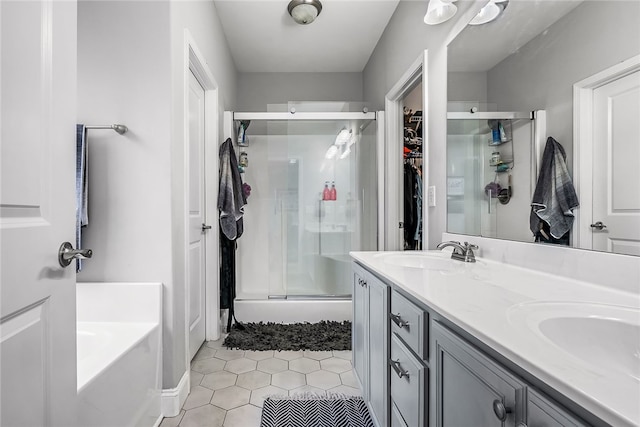 bathroom with tile patterned floors, vanity, and plus walk in shower