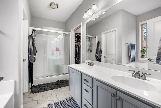 bathroom with vanity and a shower with shower door