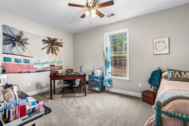 home office featuring ceiling fan and carpet floors