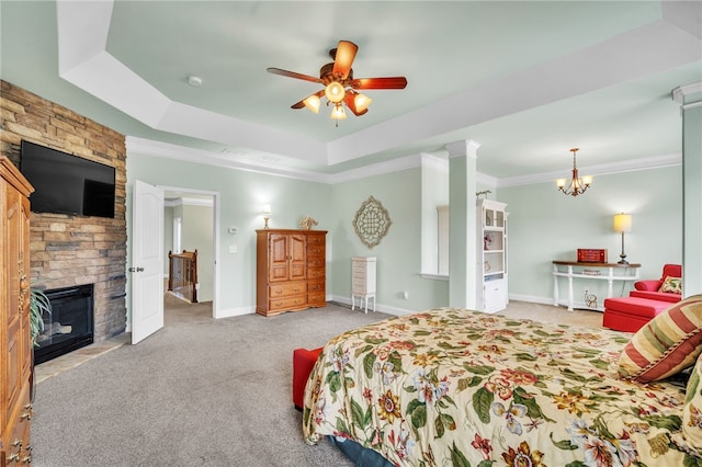 bedroom with a fireplace, a raised ceiling, and ornamental molding