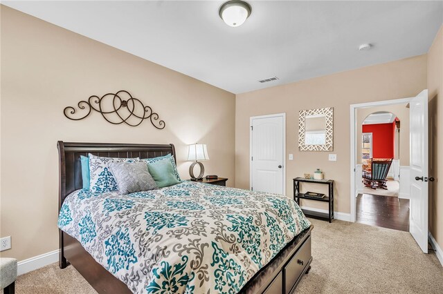 bedroom with light carpet