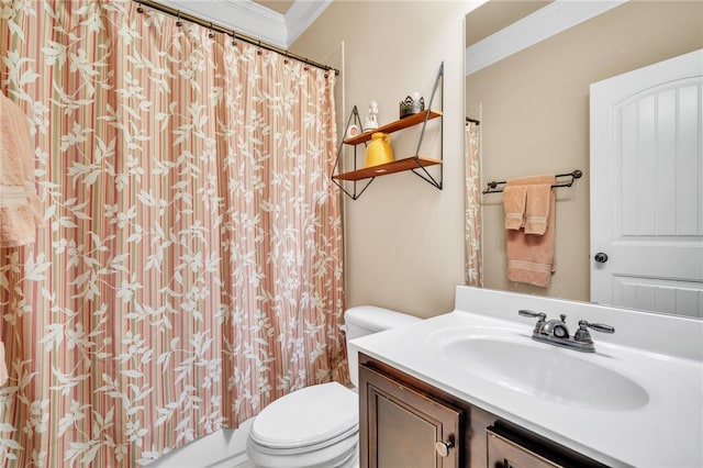 bathroom with vanity, toilet, and crown molding